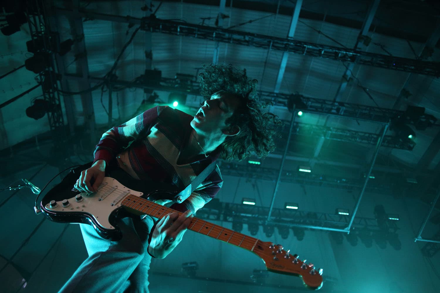 Concert photography of Matty Healy and The 1975 performing at Sprint Pavilion. Large venue rock band performance captured with professional stage lighting and dynamic crowd energy documentation.