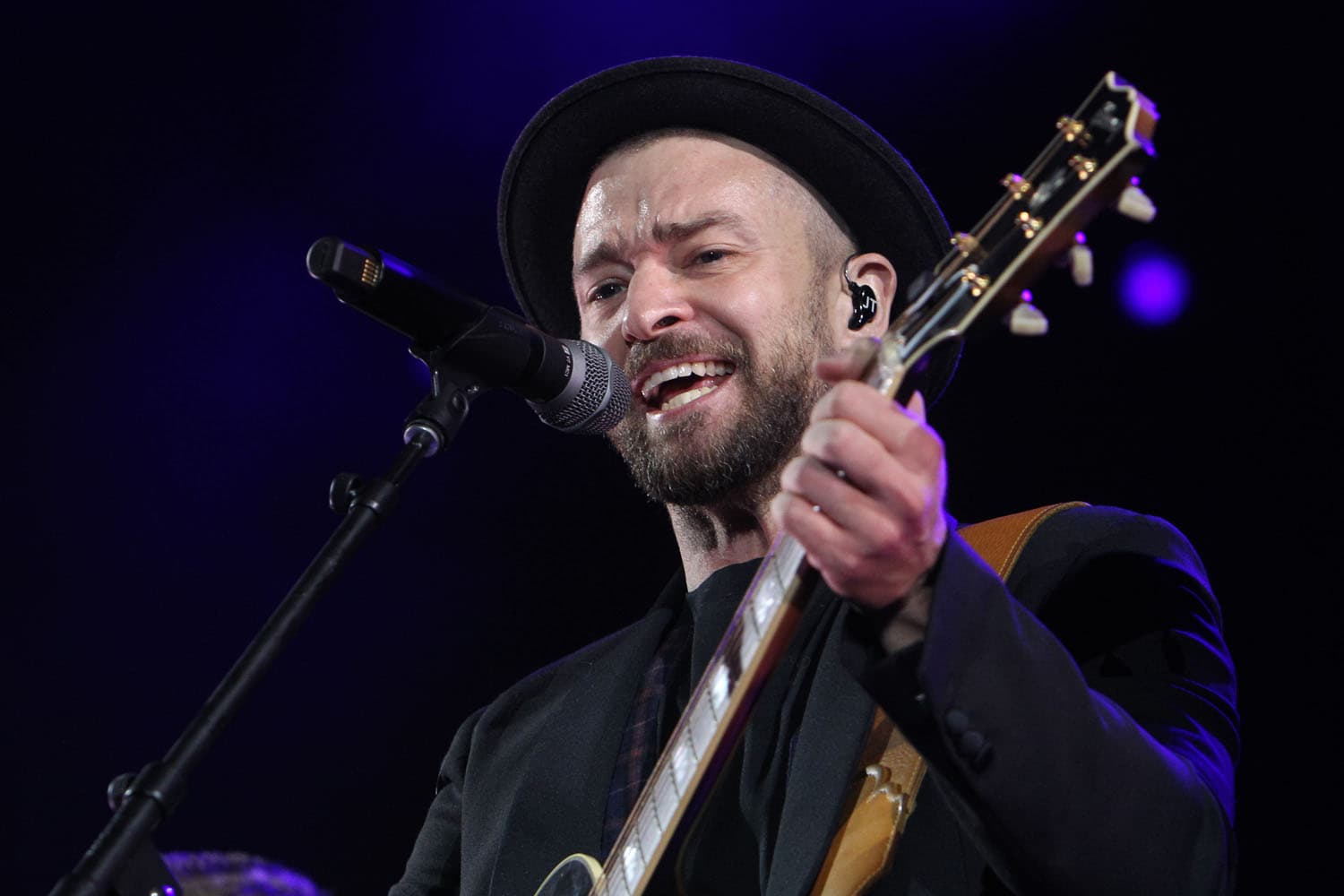Professional concert photography of pop and R&B artist Justin Timberlake performing at major music festival. Large-scale artist performance with complex choreography and stage production expertly captured.