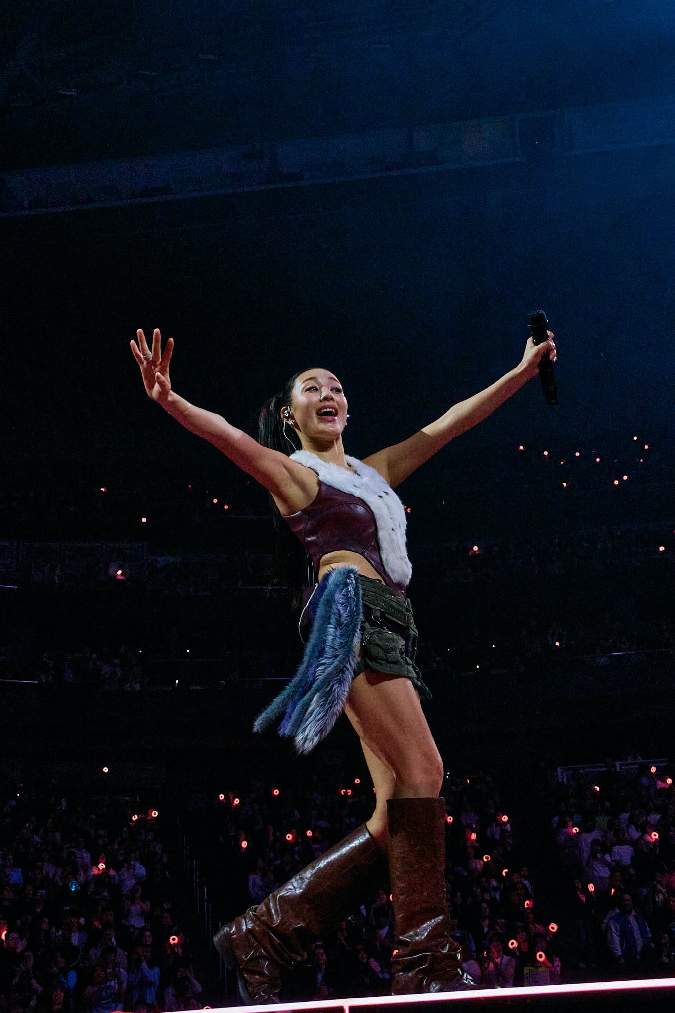 Professional K-pop concert photography of TWICE member Jihyo performing during the This Is For World Tour. High-energy idol performance with dynamic choreography and stage lighting expertly captured.