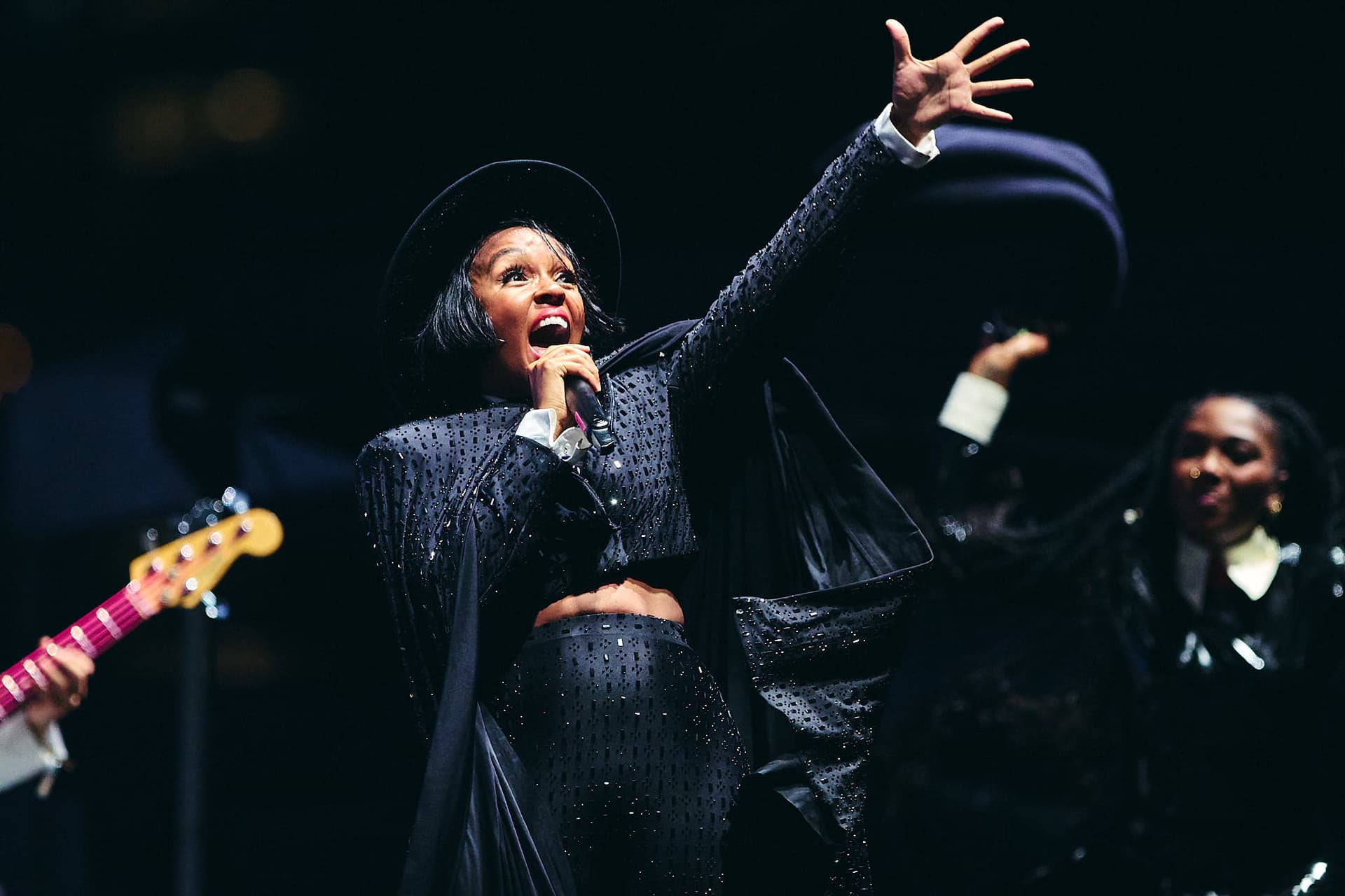 Festival concert photography of innovative artist Janelle Monae performing at Bumbershoot Arts and Music Festival. Large stage performance with dynamic choreography captured through professional music photography techniques.